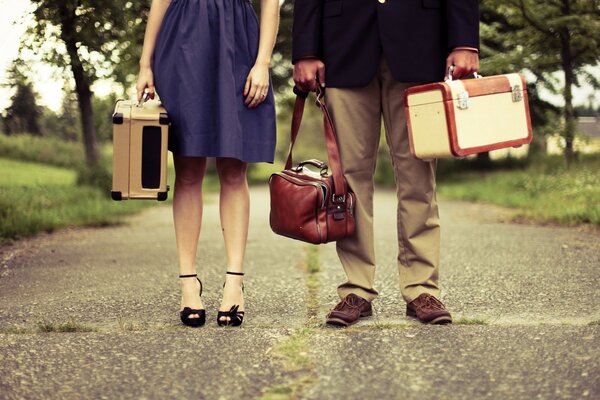 Two people with bags on the background of nature