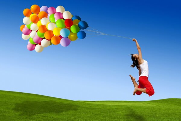 The girl flies freely to the sky on balloons, she is overwhelmed with pleasure, the free sky is spread out before her