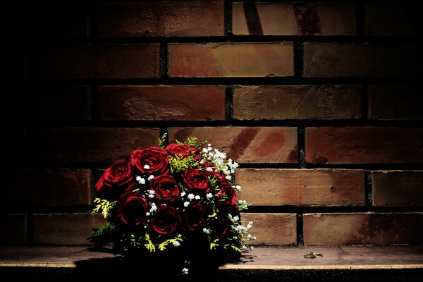 Bouquet of roses at the brick wall