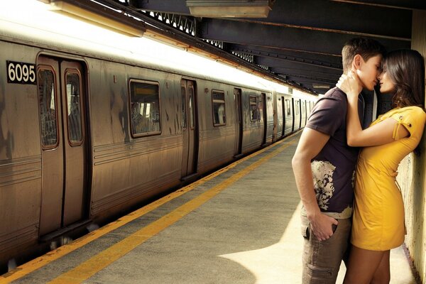 A couple in love at the railway station