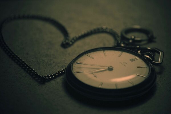 Pocket watch with chain on the floor