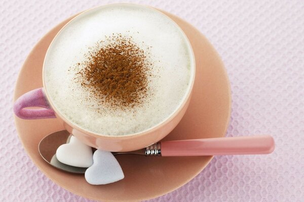 Terracotta cup with foam coffee