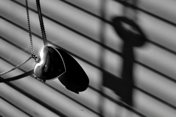 Heart keychain on a gray background