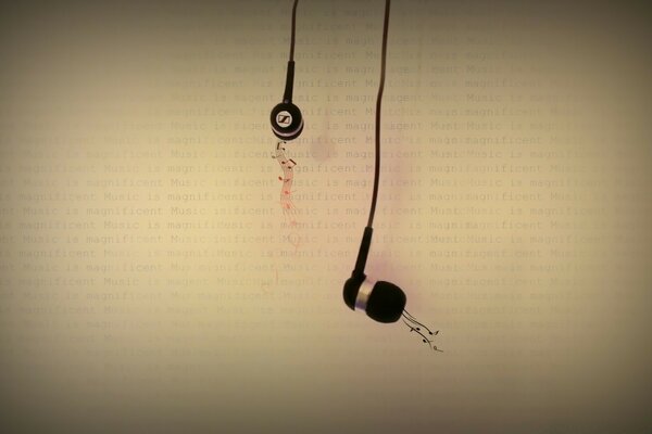 Headphones with music on the background of a book