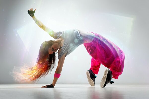 A girl is dancing a sports dance