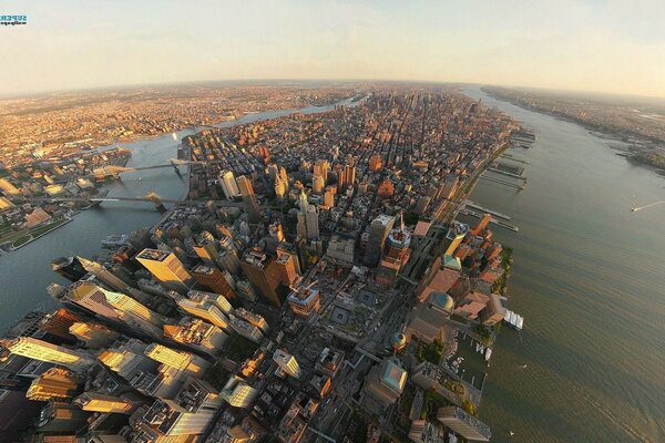 A big city from a bird s eye view with many skyscrapers and high-rise buildings