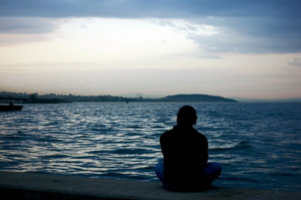 A lonely man looks at the sea