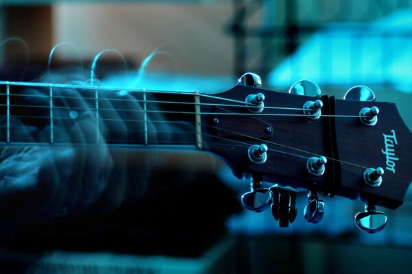 Playing guitar on a blue fln