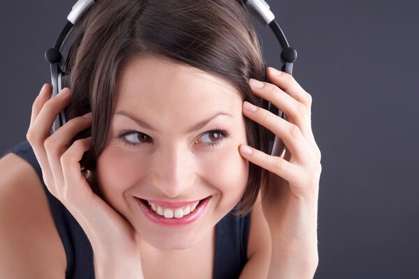 A woman happy with music in headphones