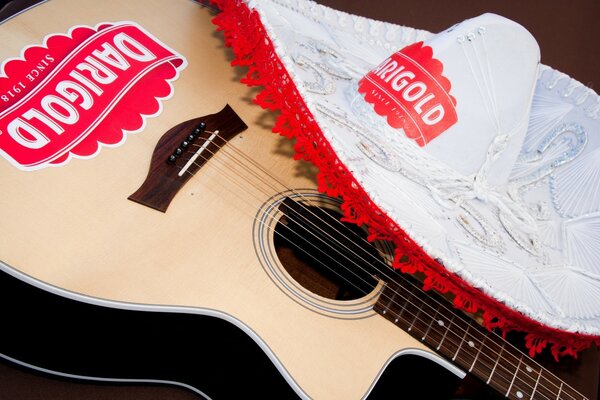 Guitar with logo and white hat