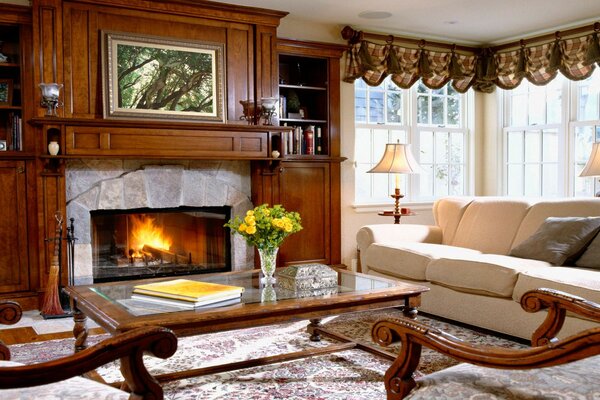 Colonial-style living room with a fire burning in the fireplace