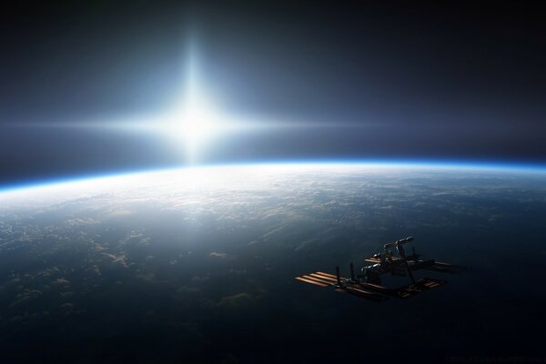 A spaceship in space against the background of the earth