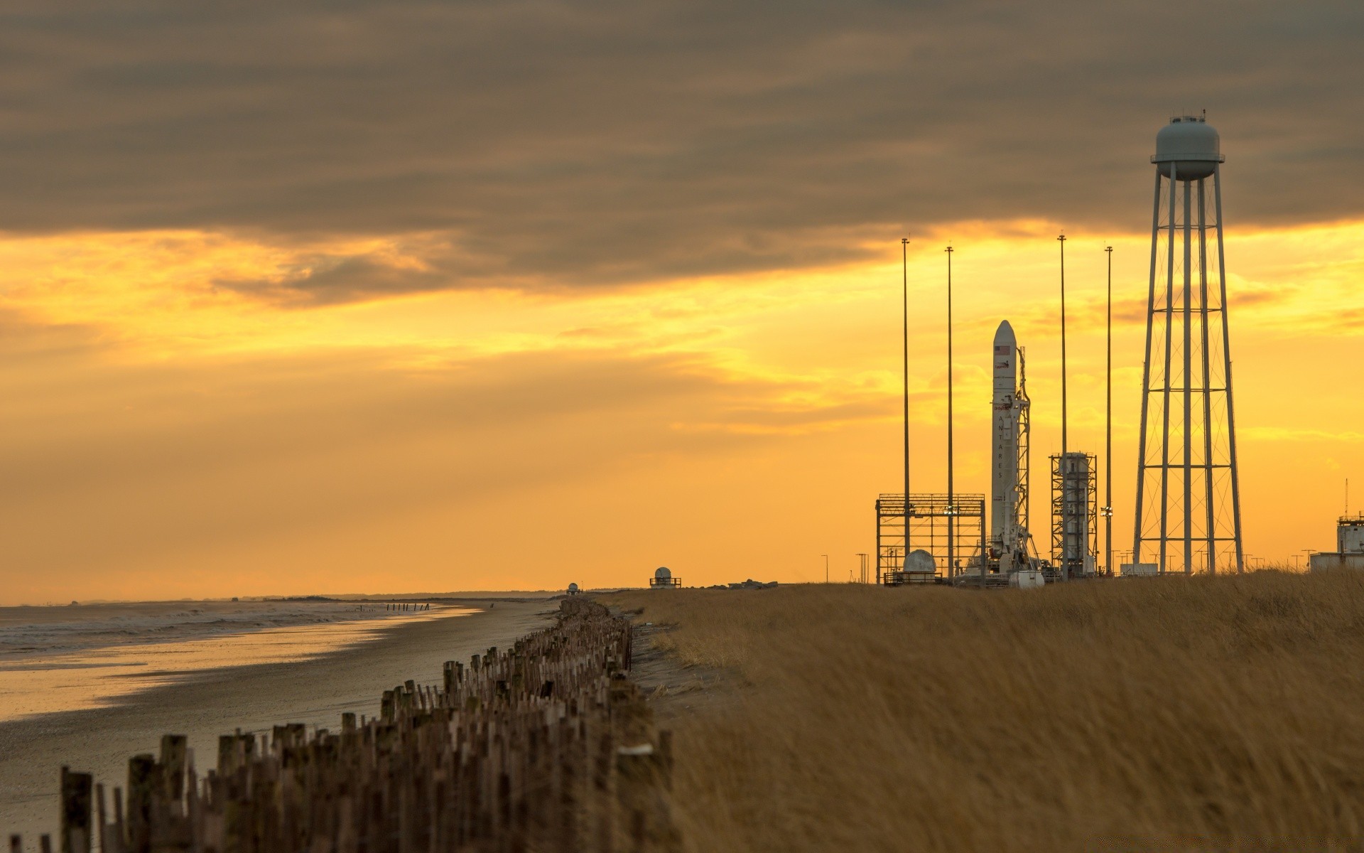 space sunset dawn water beach sea evening lighthouse landscape ocean sky seashore outdoors dusk sun light