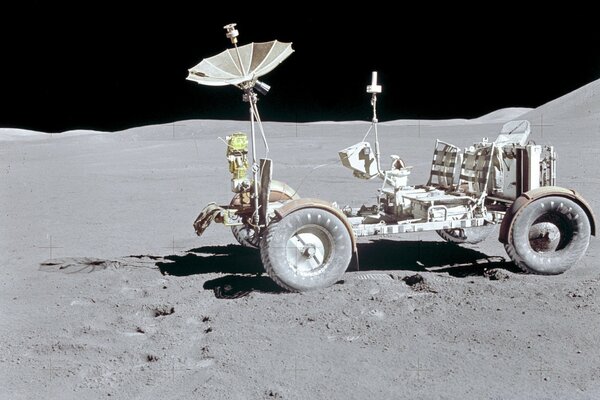 Lunar rover on the moon against the background of black space