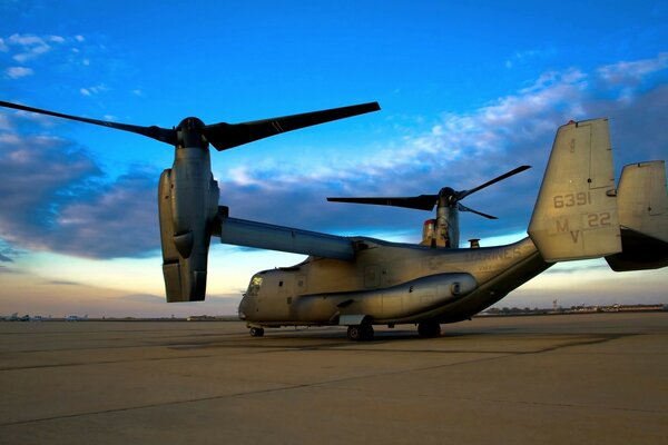 Photo of a military aircraft with vertical takeoff at the airfield