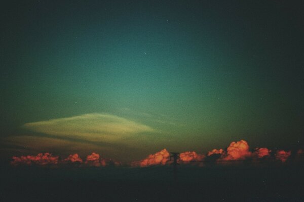 Red clouds against a gray sky