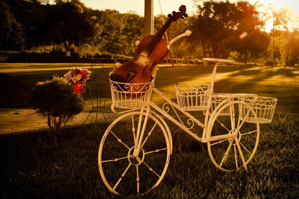 Vintage image of a decorative bicycle with a violin