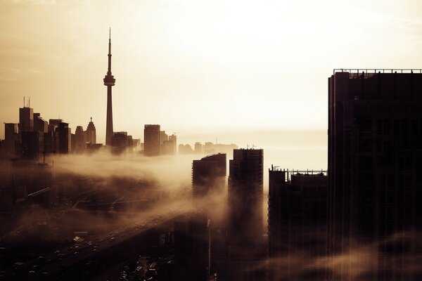 Foggy dawn in the city from a height