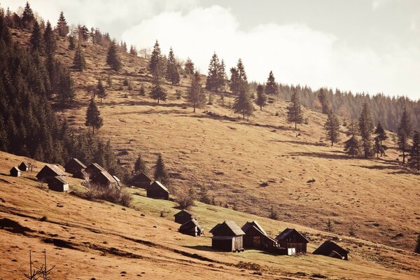 Houses in the mountains under the slope vintage