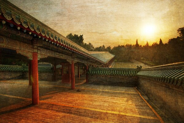 Vintage photo with a temple on the background of sunset