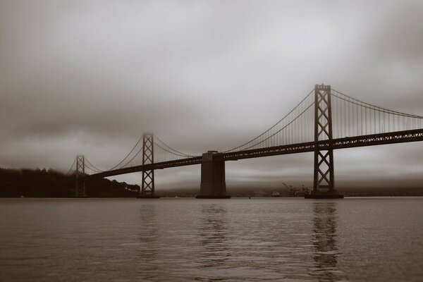 The suspension bridge is mysteriously swinging in the fog