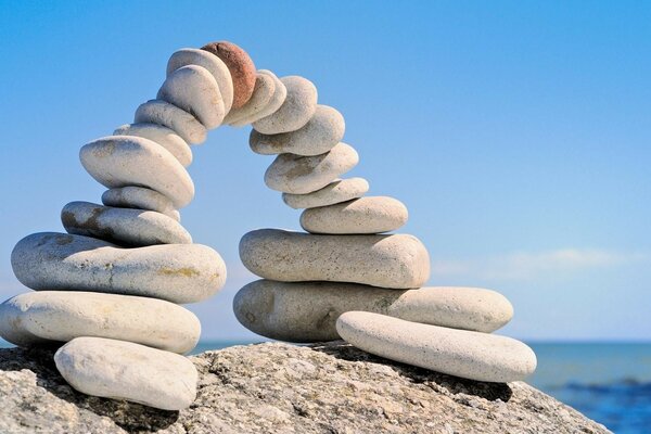 A figure made of stones near the sea