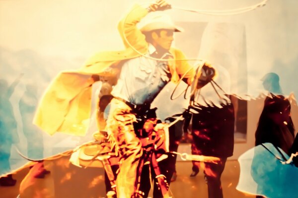 Cowboy on horseback with a lasso, entourage