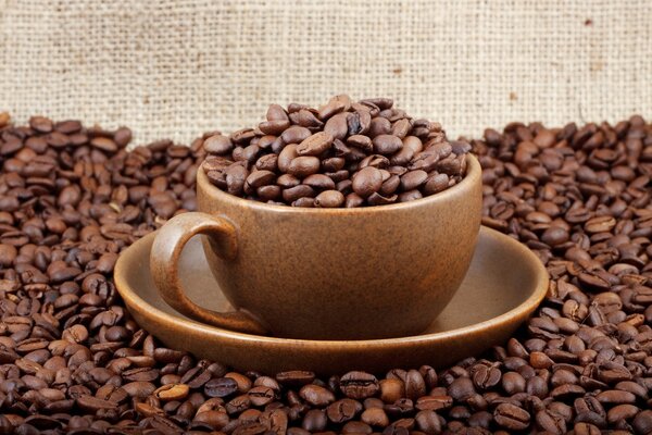 A mug with coffee beans on the table