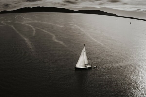 White sailboat on the sea surface