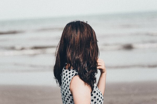 Dark-haired girl on the seashore