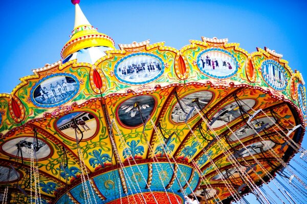 Bright children s carousel against the sky