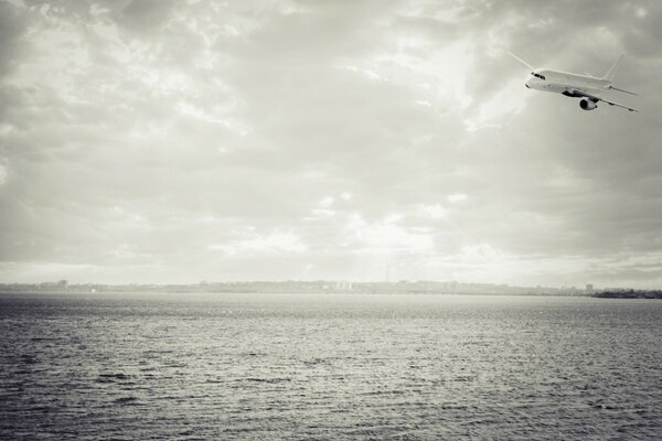 The plane comes in to land from the sea