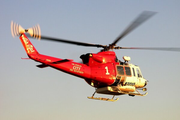 Helicopter gaining altitude in the air