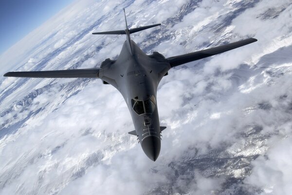 Modern aircraft high above the clouds