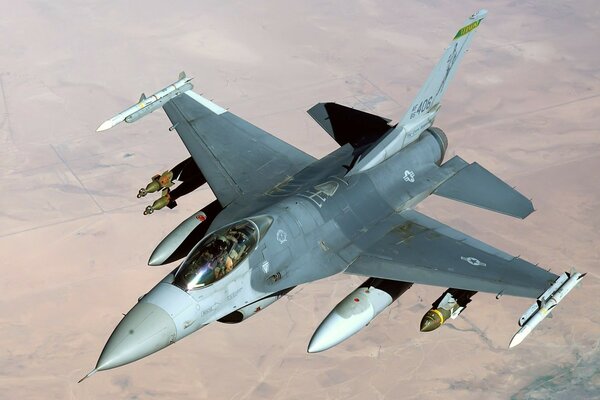 Photo of a military aircraft on the background of the desert