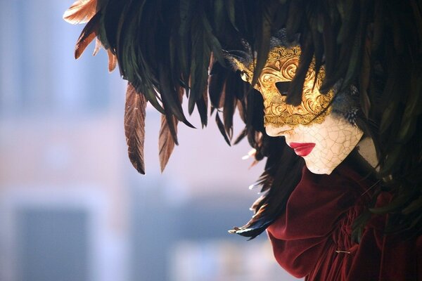 Portrait of a beautiful girl in a masquerade mask