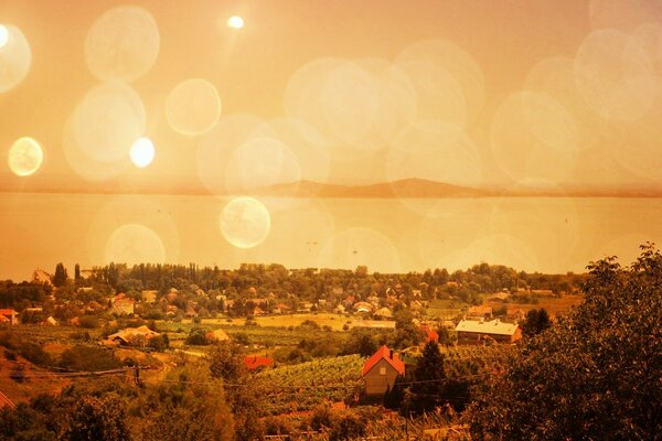 Vintage photo of the village landscape at sunset