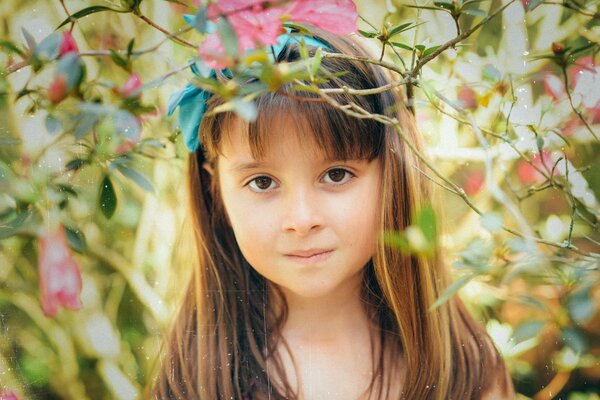 Brown-eyed baby in the summer garden