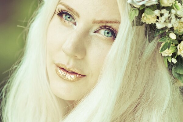 Gentle blonde with a wreath on her head