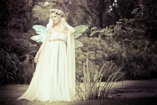 Vintage image of a girl in a wedding dress with wings