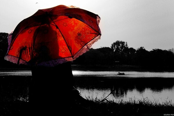 Vintage black and white image of a girl with a red umbrella