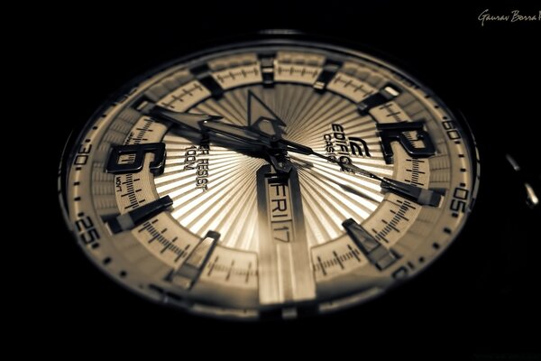 The dial of the clock with backlight in the vicinity