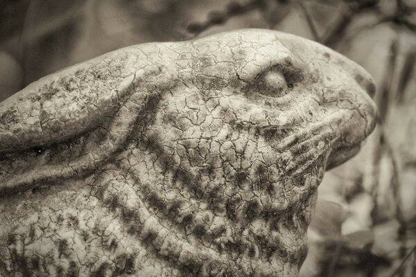 A stone rabbit with a sad face