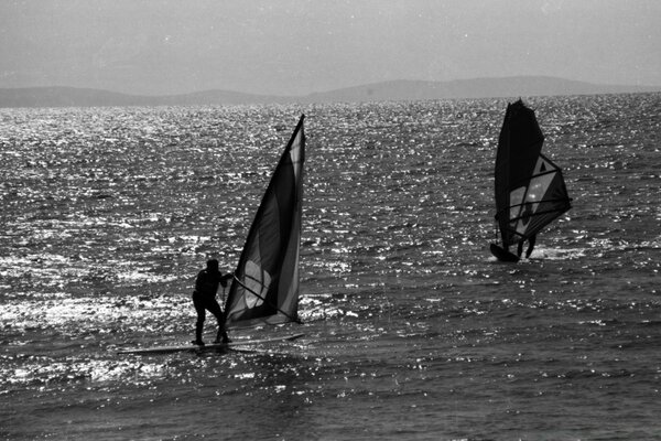 Two swimmers on small rafts