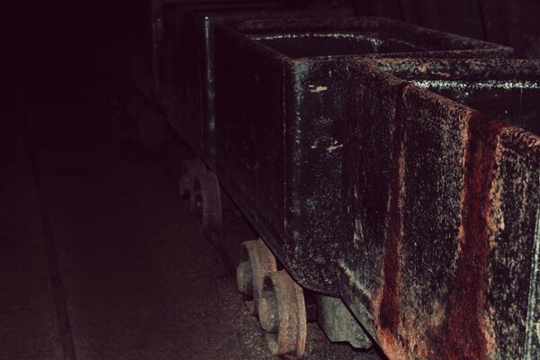 Rusty industrial carts in an abandoned building