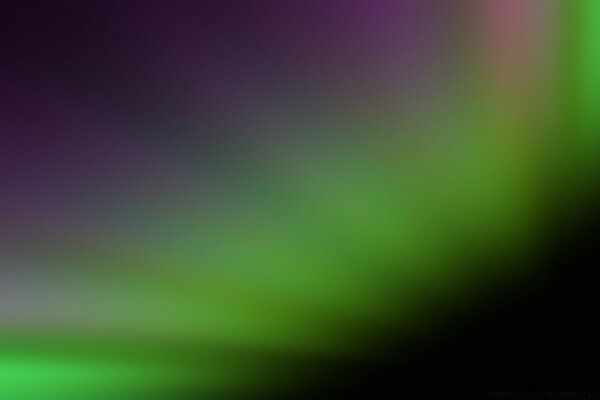 Blurred gradient of purple green and black