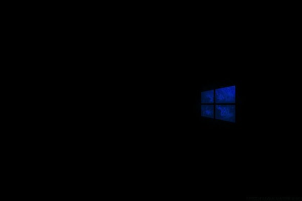 A window with a dark landscape on a black background