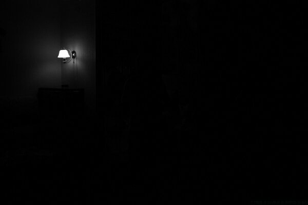 Light from a lamp in a black room