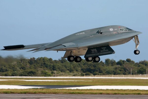 A military plane takes off from the runway