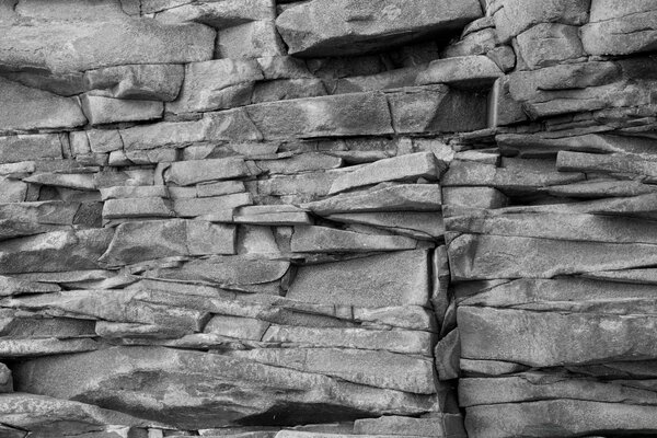 Textured stone wall. An old stone. Desktop background